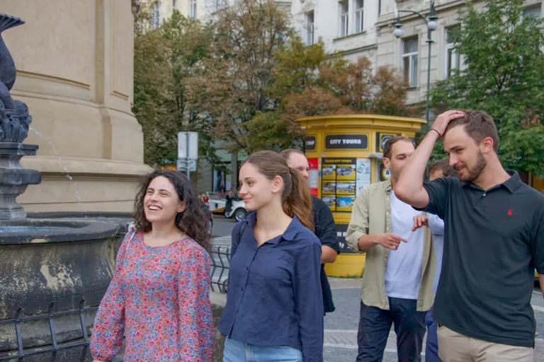 Teams running around Prague, doing team building activities